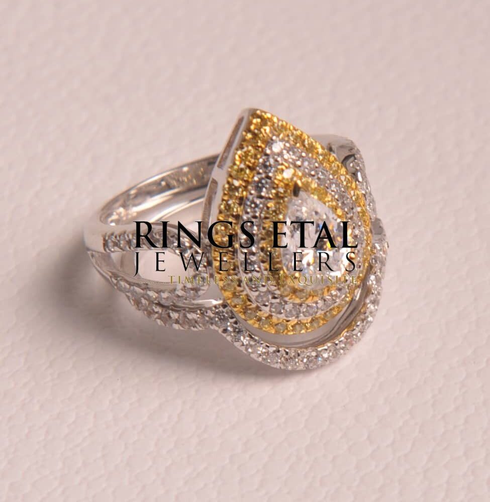 Pear shaped  bridal set in 18karats two tones gold with Cubic stones