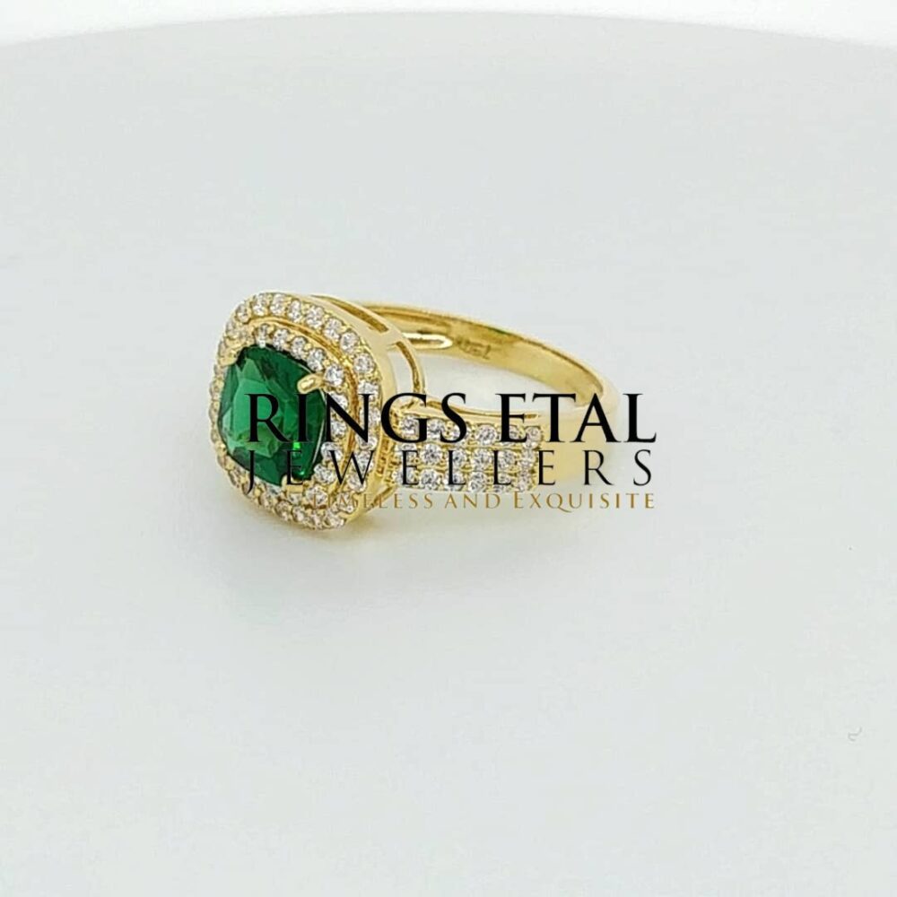 Topsy engagement ring with emerald stone (Cubic zirconia stones)
