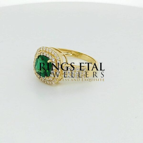 Topsy engagement ring with emerald stone (Cubic zirconia stones)
